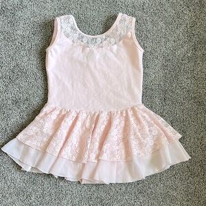 Pink leotard with attached skirt. Fun lace detailing. Sz- 140 fits 8/9